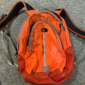 Orange north face vault bag